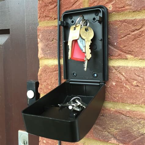 metal lock box with key with door that slides up|combination lock for keys.